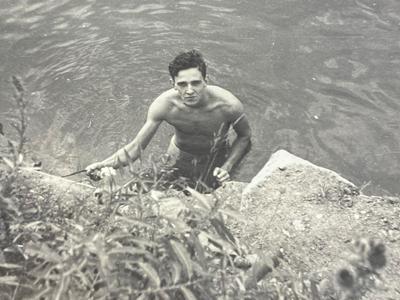 a man swimming in a body of water