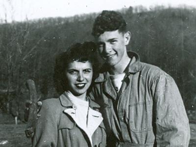 a vintage photo of a man and a woman posing for a picture