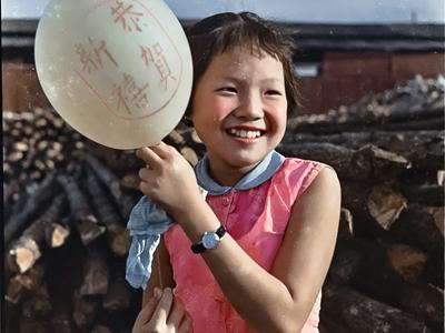 a little girl posing for a picture