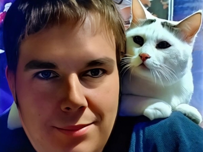 a cat wearing a collared shirt