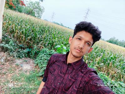a person that is standing in the grass