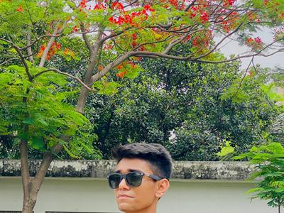 a person standing in front of a tree