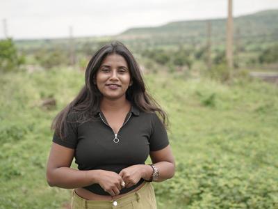 a woman standing in a field