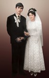Old wedding photo restored, retouched, background replaced and colorized