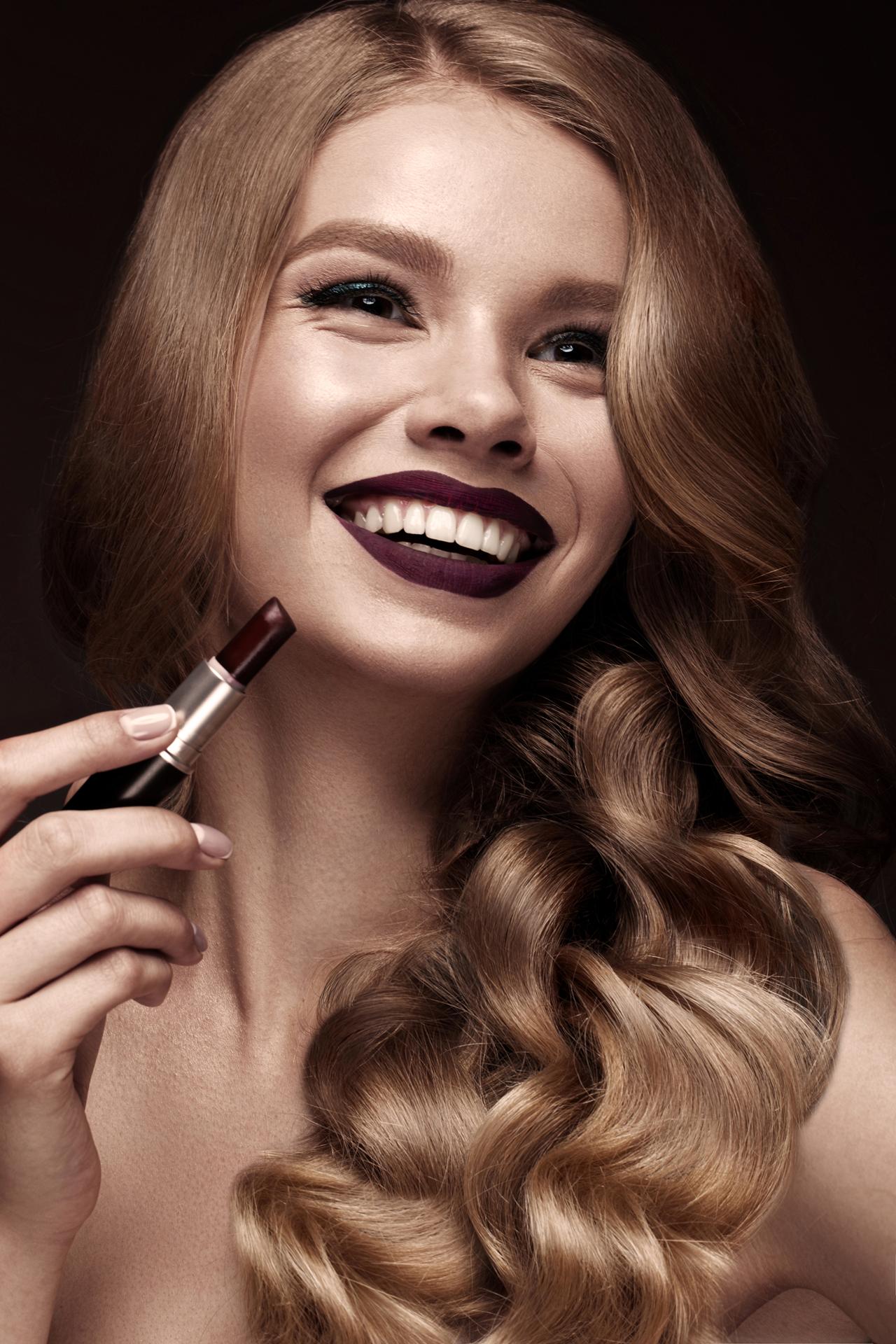 woman-with-curls-makeup-with-lipstick-in-hand-2022-05-09-22-46-51-utc (1)